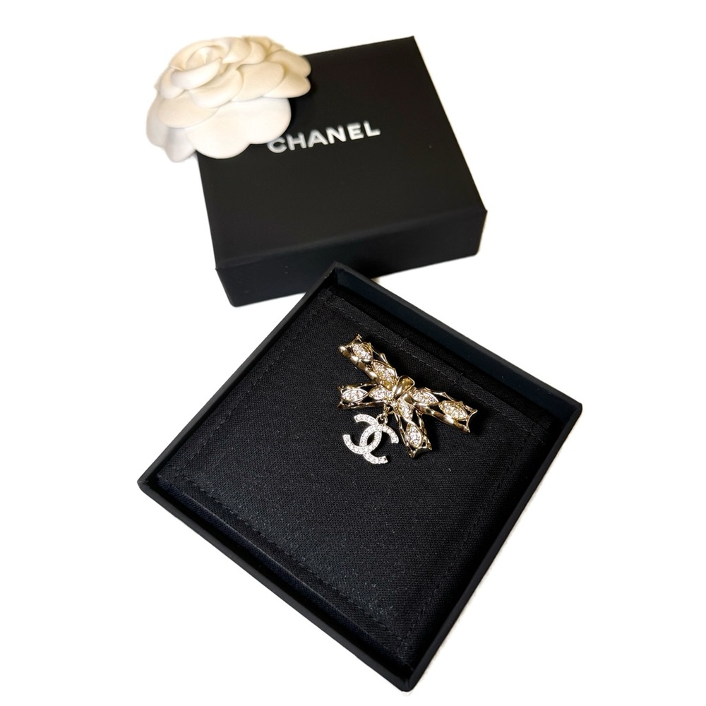 CHANEL Gold and Clear Crystal Bow Brooch with CC Charm